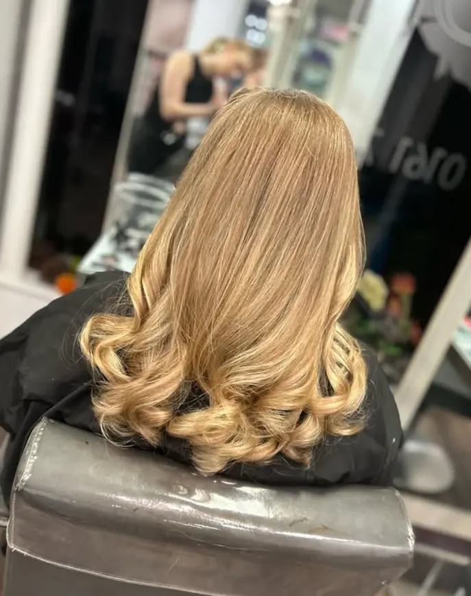 Blonde balayage hair transformation by Hair By Amy